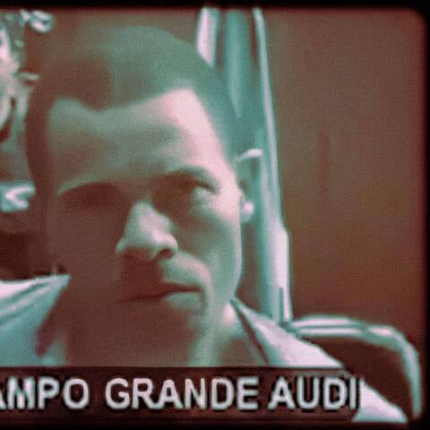 Grainy video still of a man during a court hearing held by videoconference.