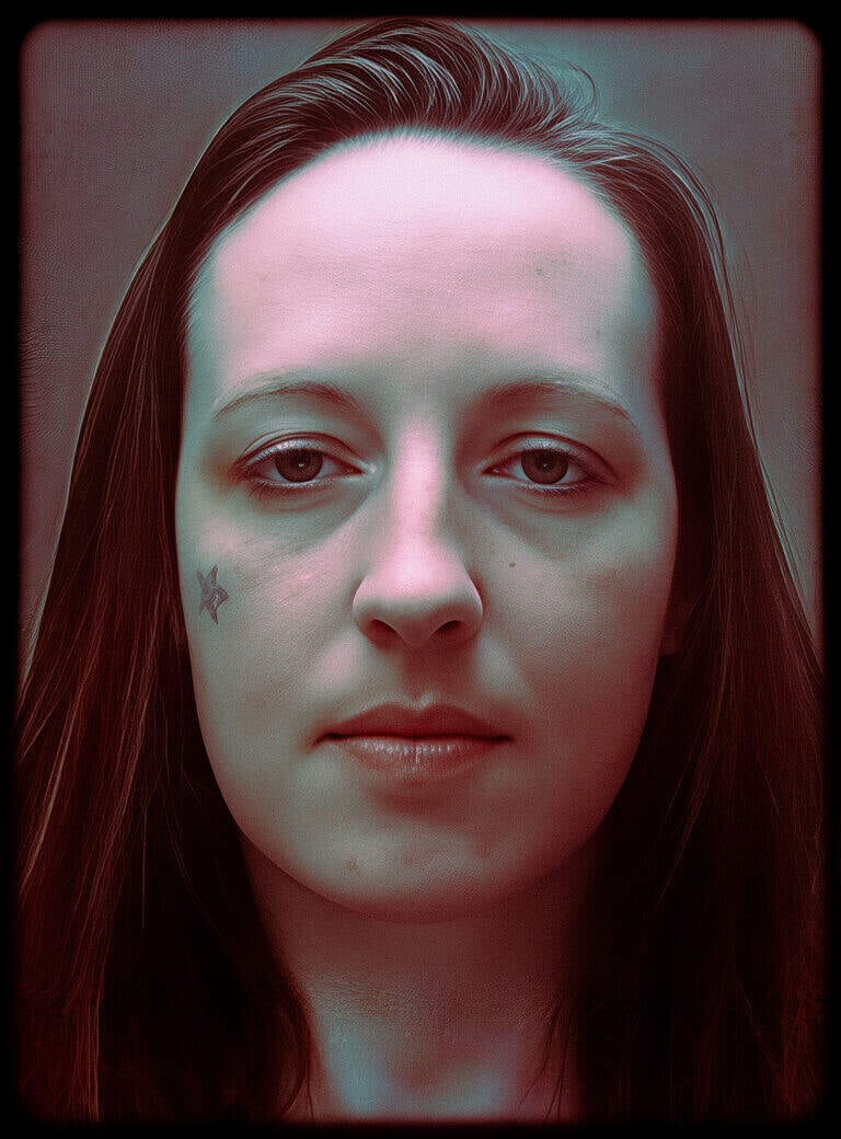 Close-up portrait photograph of Joanna Dennehy, a woman with dark hair and a small star tattoo under her left eye.