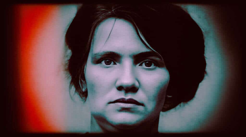Portrait of a woman with intense expression, symbolizing human darkness.