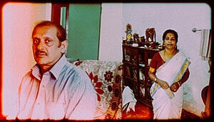 Elevated photo of a middle-aged man and woman in traditional attire, capturing human complexity and societal aspects.