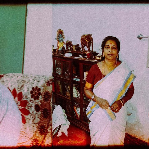 Elevated photo of a middle-aged man and woman in traditional attire, capturing human complexity and societal aspects.