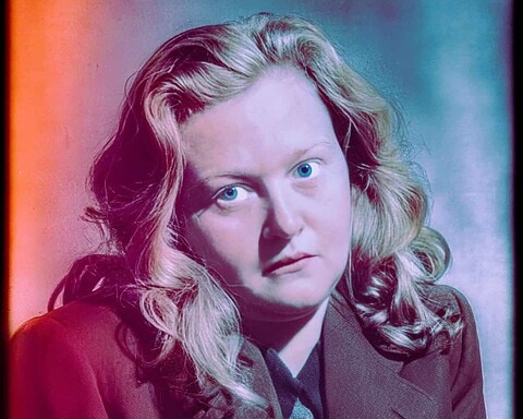 Eerie portrait with intense blue eyes and vintage style, capturing the dark depths of human nature.