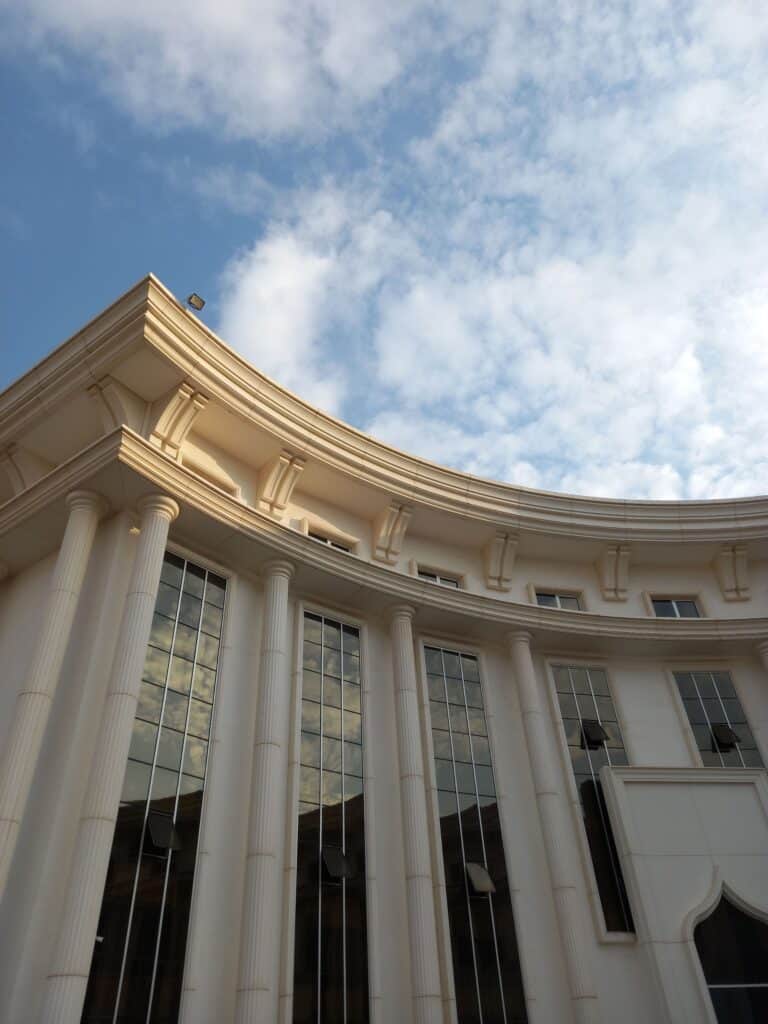 Stone courthouse facade with tall classical columns.