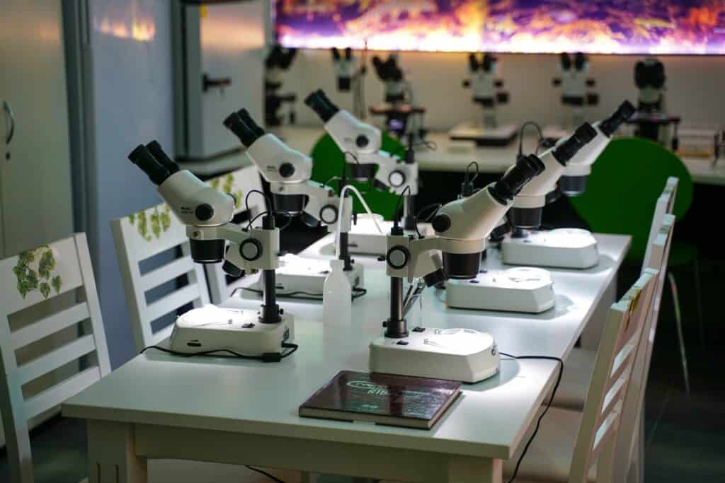 what is necrophilia Microscopes arranged on tables in a modern forensic laboratory.