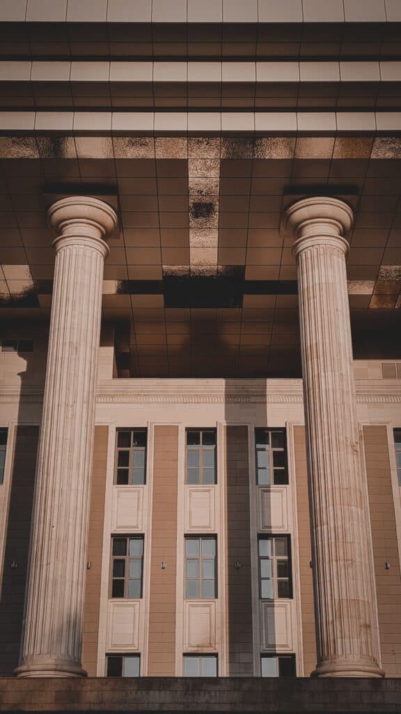 Tall stone columns at the entrance to a courthouse.