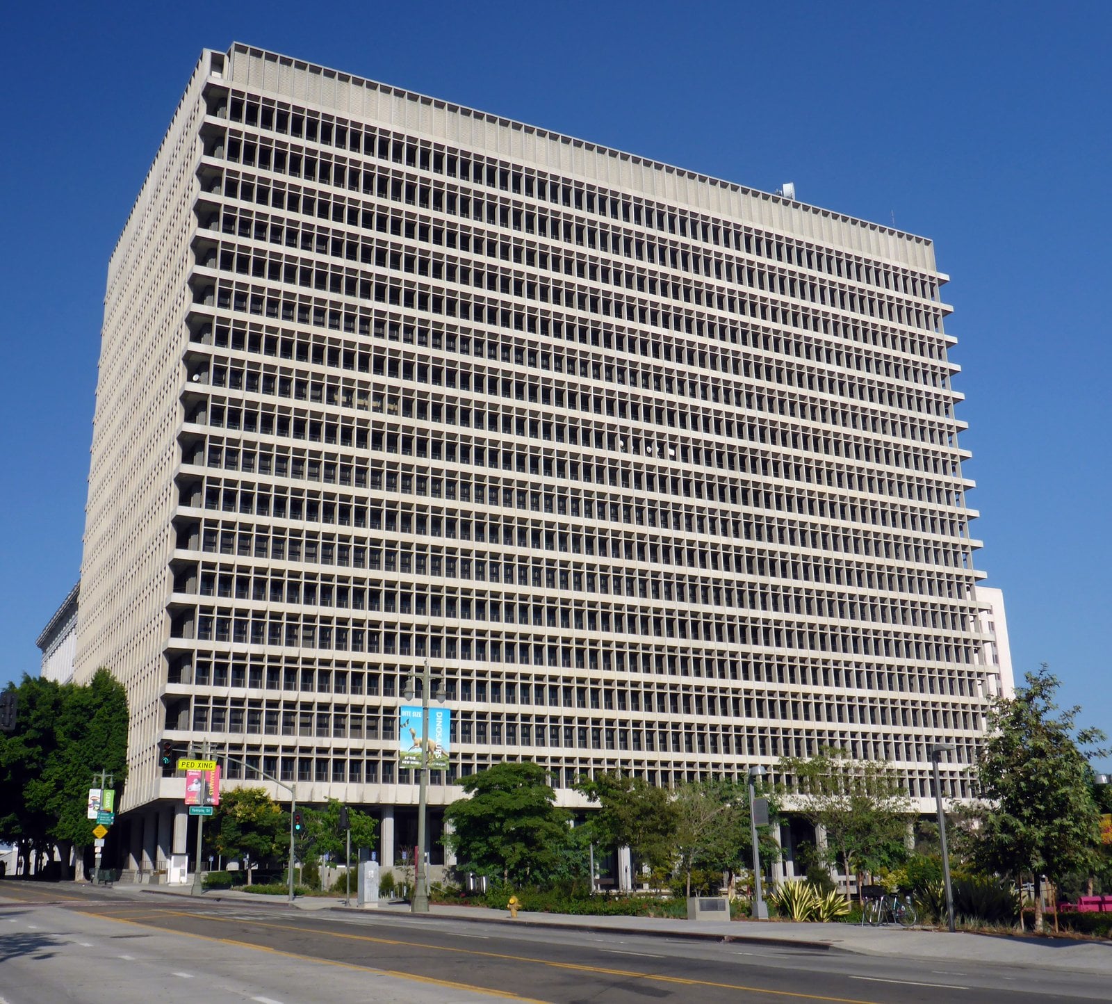 The tall concrete facade of the Clara Shortridge Foltz Criminal Justice Center in downtown Los Angeles under a blue sky
