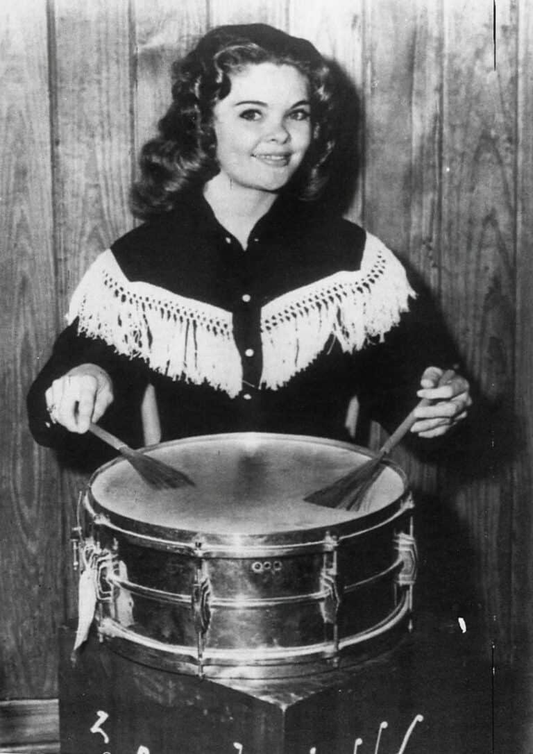 Candy Barr playing drums in the Huntsville Prison Rodeo in 1960. Original caption: USPQ93002-9/30/60-Huntsville,TEX: Candy Barr, former night club stripper, will sing and play drums between Events at…