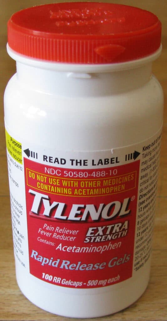 Close-up of a bottle of Extra Strength Tylenol capsules.
