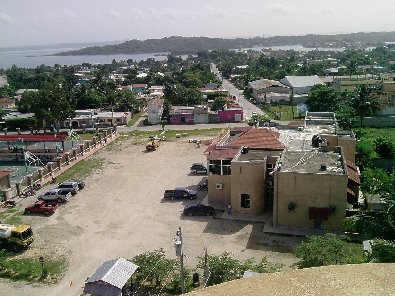 Elevated view over the town hall and rooftops of San Benito, Petén, with Lake Petén Itzá behind