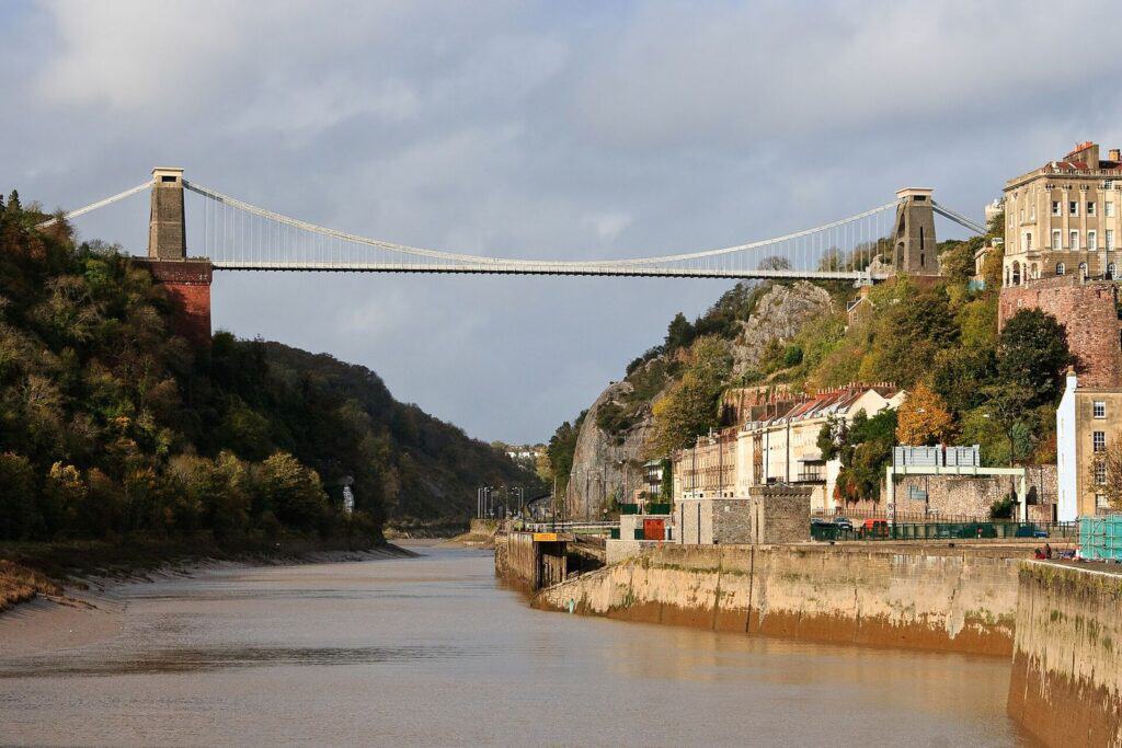 The Clifton Suspension Bridge spanning the Avon Gorge in Bristol, seen from the riverside.
