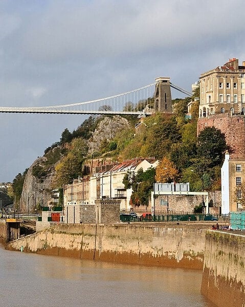The Clifton Suspension Bridge spanning the Avon Gorge in Bristol, seen from the riverside.