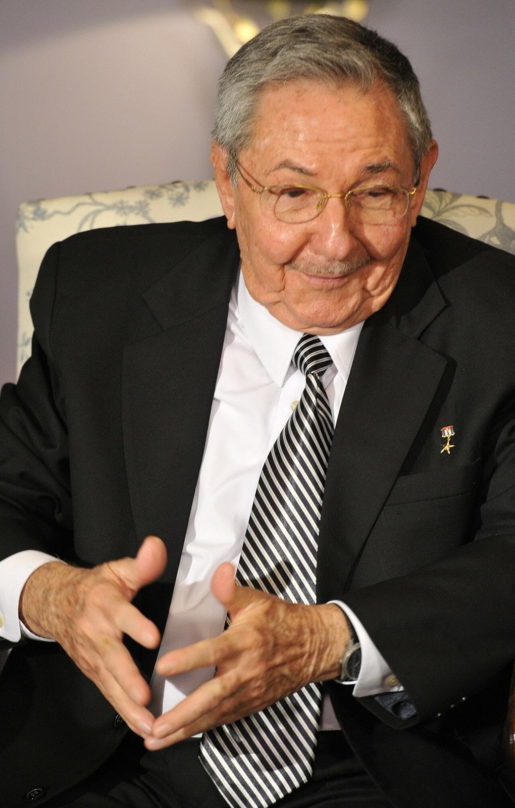 Raúl Castro, former Cuban leader, seated in a suit in July 2012