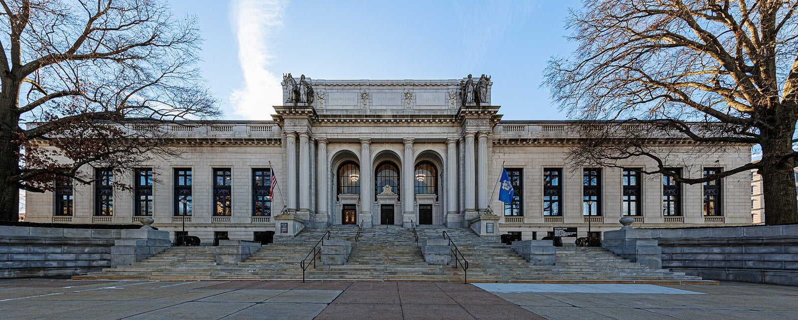 The neoclassical Connecticut State Library and Supreme Court Building in Hartford, with a wide stone stairway and bare trees