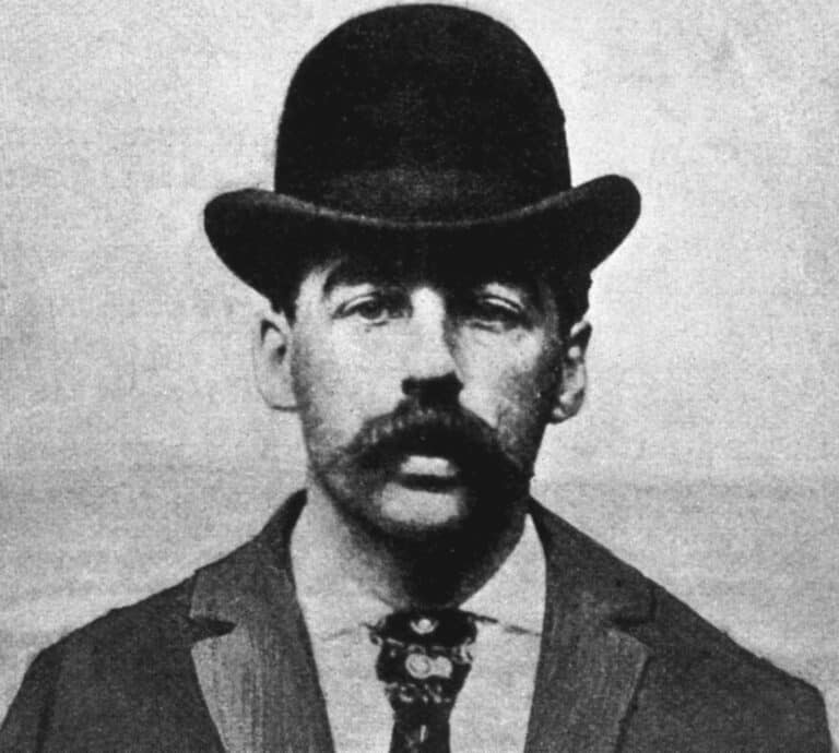 Black and white portrait of H.H. Holmes, born Herman Webster Mudgett, wearing a bowler hat, moustache and dark jacket, circa 1880s to 1890s